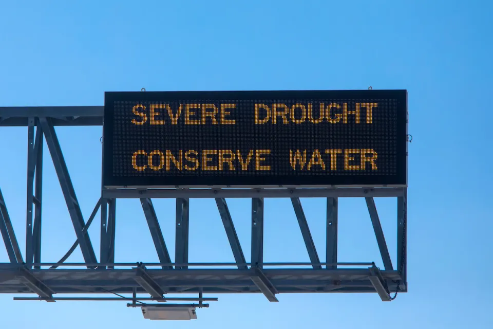 "Severe Drought - Conserve Water" freeway sign.
